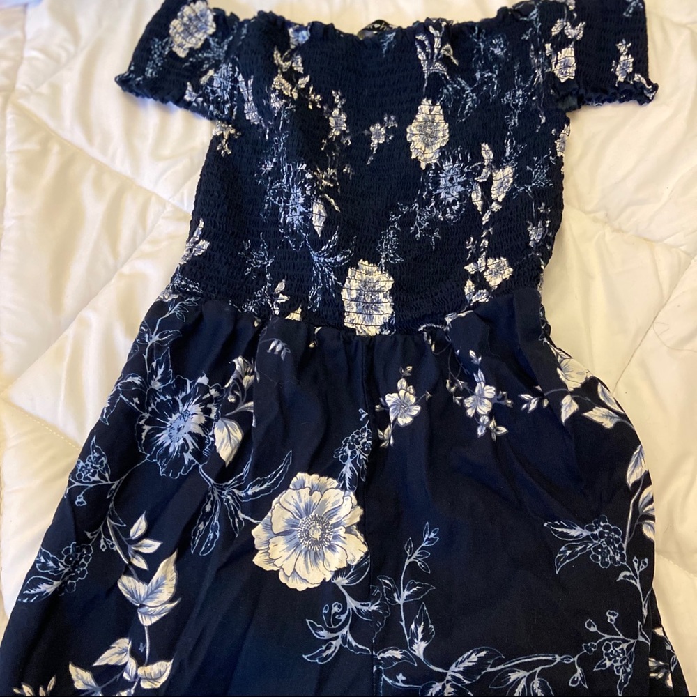 Blue romper  with flowers on it , size M